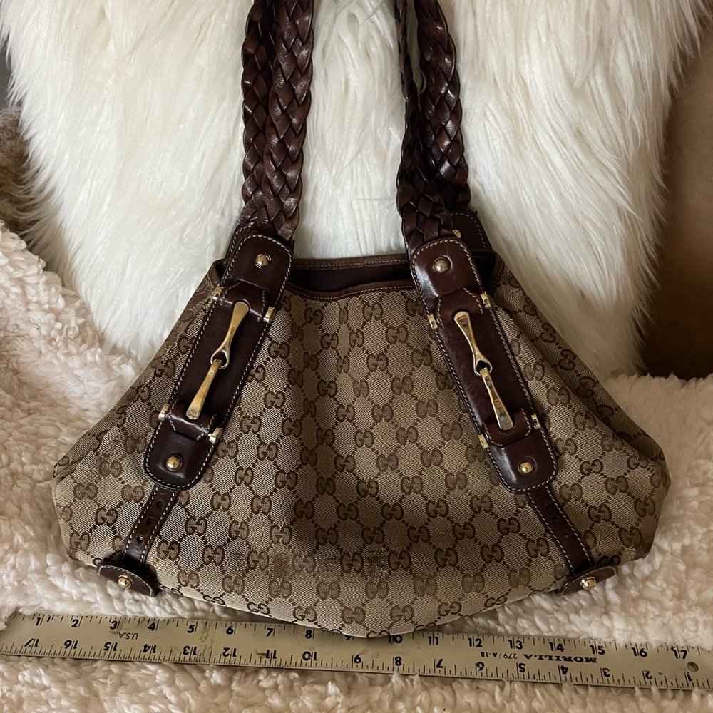 Original authentic vintage Gucci handbag; leather, trim; brass accents